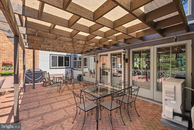 view of patio with outdoor dining space and grilling area