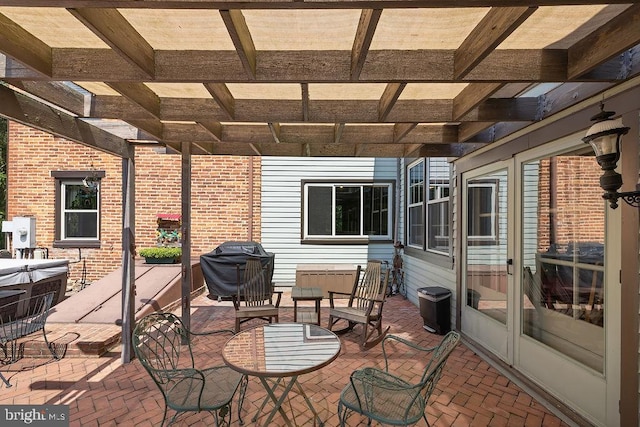 view of patio / terrace with a grill and a pergola