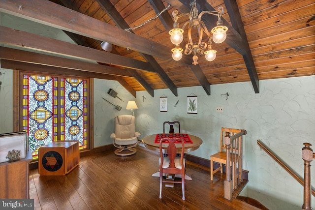 unfurnished room featuring lofted ceiling with beams, an upstairs landing, wooden ceiling, baseboards, and hardwood / wood-style flooring