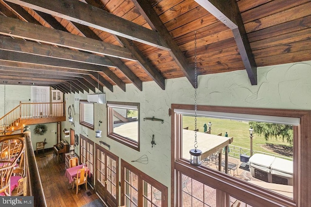 interior space featuring vaulted ceiling with beams, wood-type flooring, wood ceiling, and a textured wall