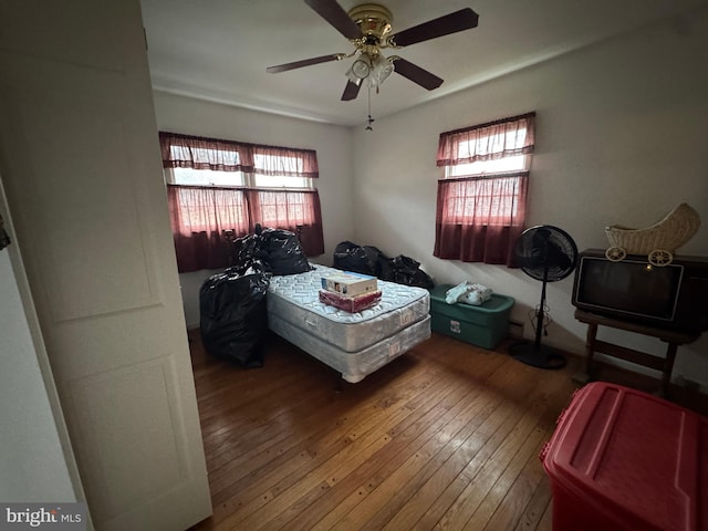 bedroom featuring ceiling fan and hardwood / wood-style flooring