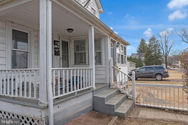 entrance to property featuring covered porch