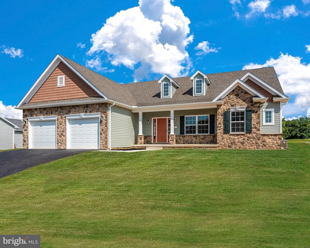 view of front of property with a garage, a shingled roof, stone siding, aphalt driveway, and a front lawn