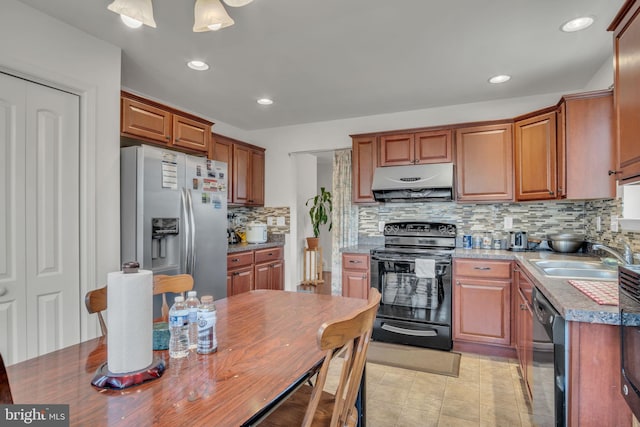 kitchen featuring decorative backsplash, under cabinet range hood, black appliances, a sink, and recessed lighting