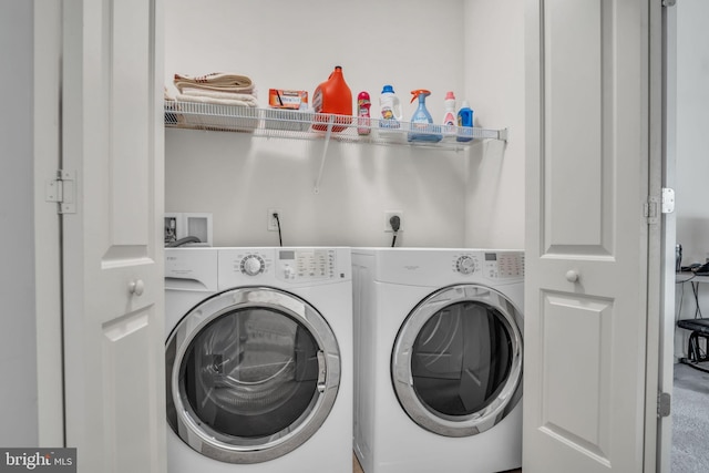 clothes washing area with laundry area and washer and clothes dryer