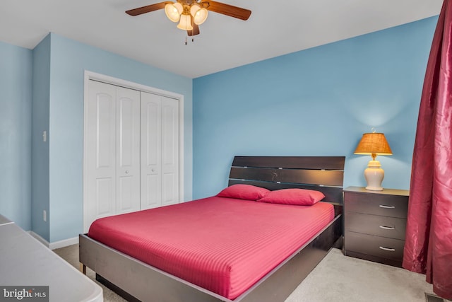 bedroom featuring a closet, carpet flooring, and a ceiling fan