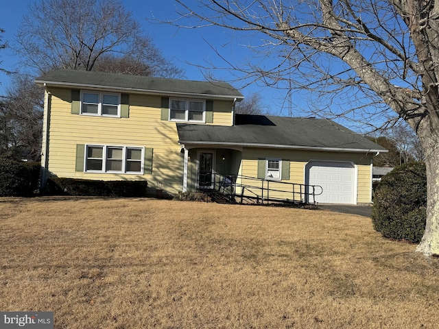 traditional home featuring a garage and a front lawn