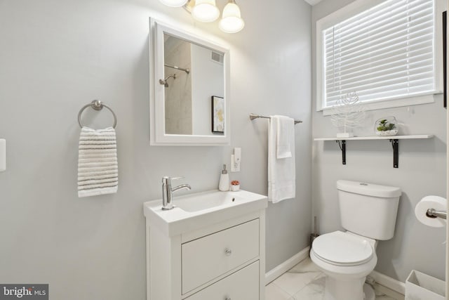 full bath with toilet, visible vents, vanity, baseboards, and marble finish floor