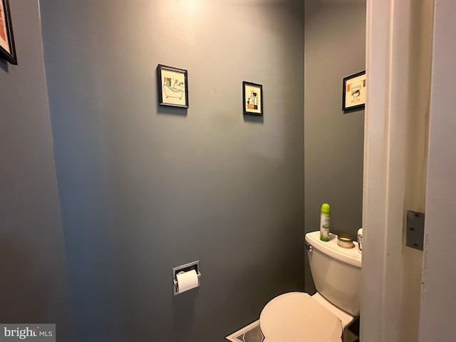 bathroom featuring visible vents and toilet