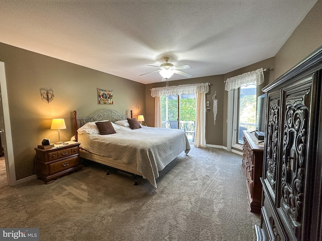 bedroom with access to outside, carpet, a textured ceiling, and baseboards