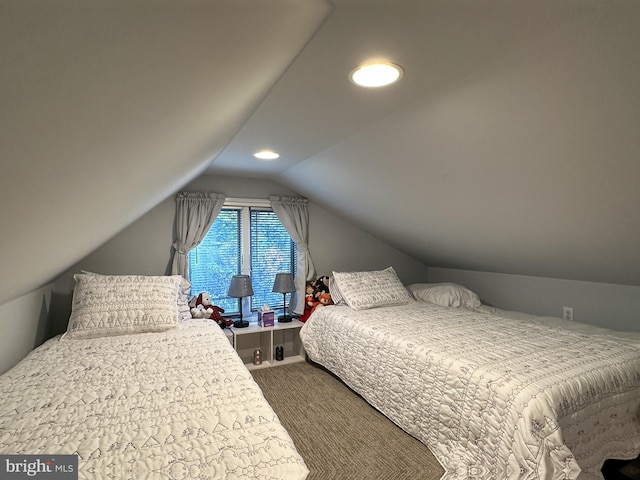 bedroom featuring recessed lighting, vaulted ceiling, and dark colored carpet