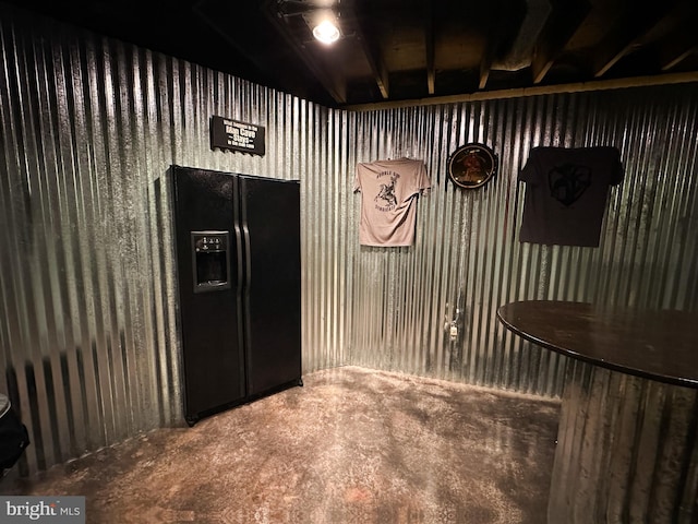 interior space featuring black refrigerator with ice dispenser