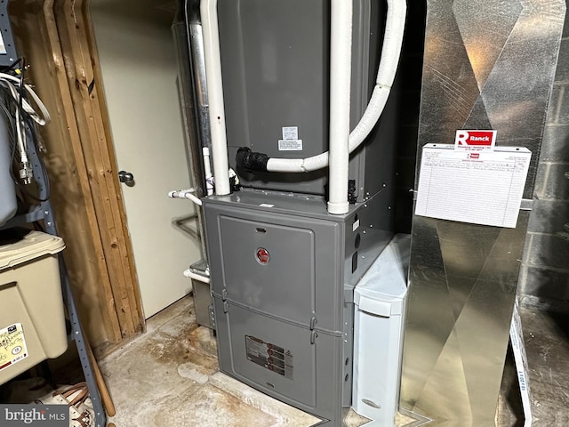 utility room with heating unit