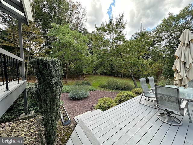 deck featuring outdoor dining area