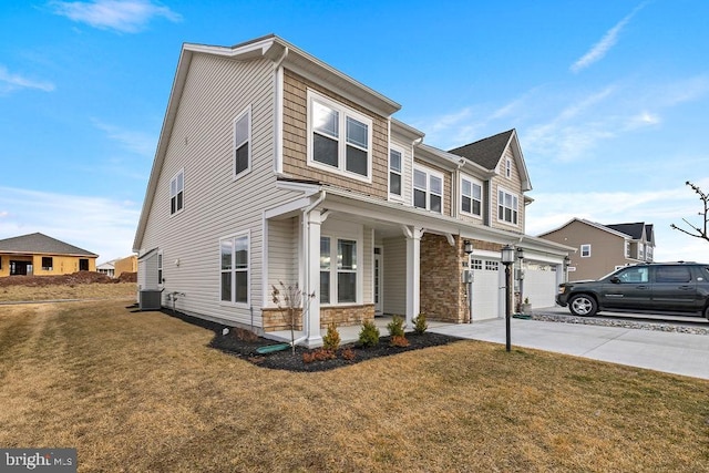 view of property featuring a porch, a garage, central AC, driveway, and a front lawn