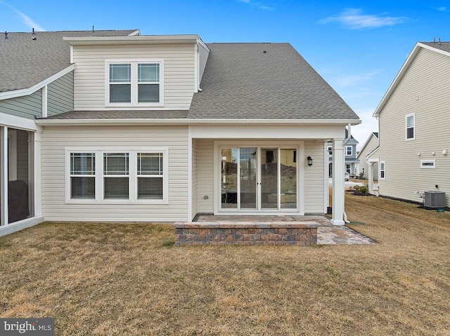 back of house with a patio area, a shingled roof, cooling unit, and a yard