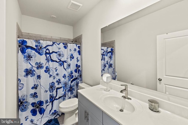 bathroom with a shower with shower curtain, visible vents, vanity, and toilet