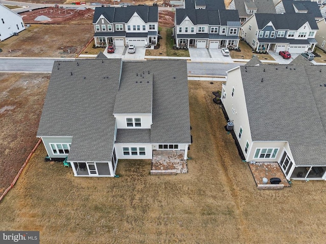 birds eye view of property with a residential view