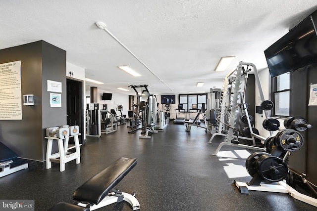 workout area with a textured ceiling