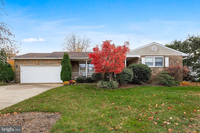 single story home featuring driveway, stone siding, a front yard, an attached garage, and brick siding