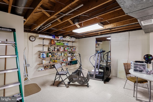 unfinished below grade area with tile patterned floors and visible vents