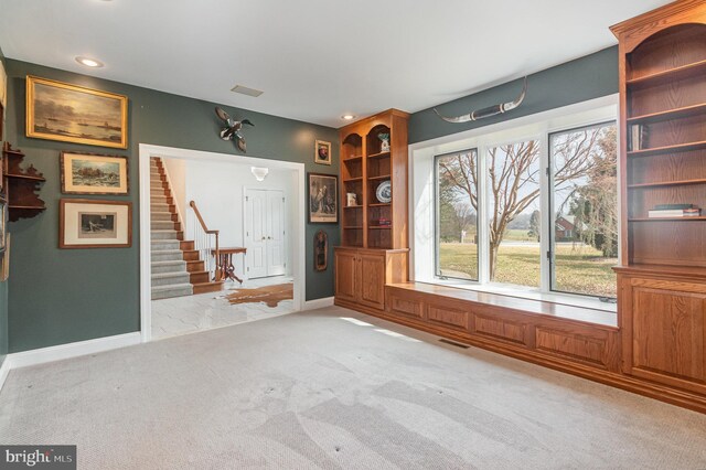 interior space featuring visible vents, recessed lighting, stairway, and baseboards