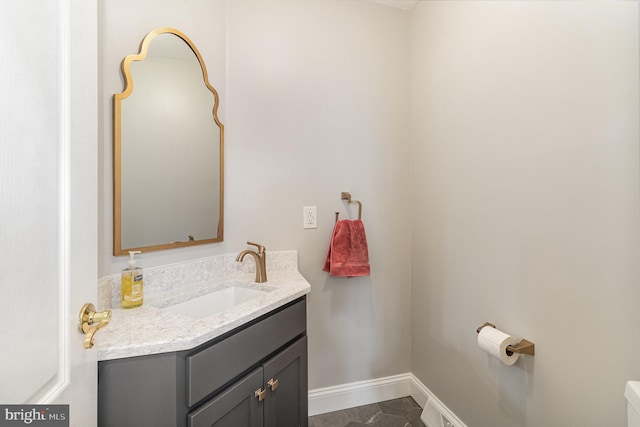 bathroom with vanity and baseboards