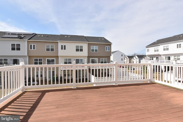 wooden terrace featuring a residential view