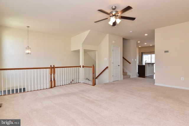 unfurnished room featuring visible vents, ceiling fan with notable chandelier, recessed lighting, carpet flooring, and baseboards