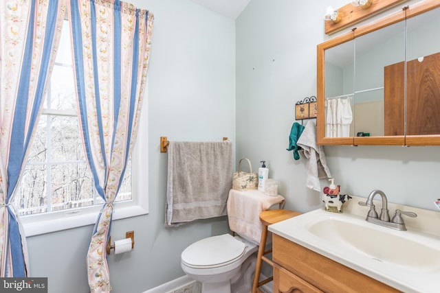 full bathroom featuring toilet and vanity