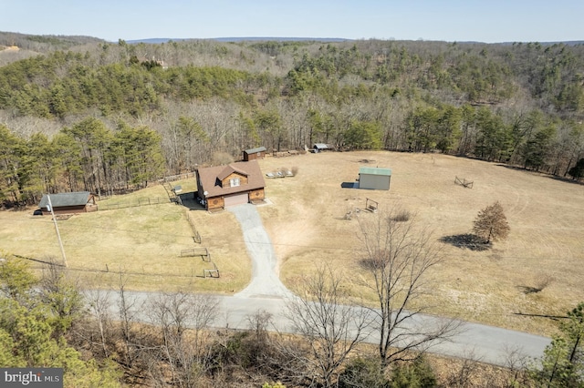 aerial view with a rural view and a wooded view