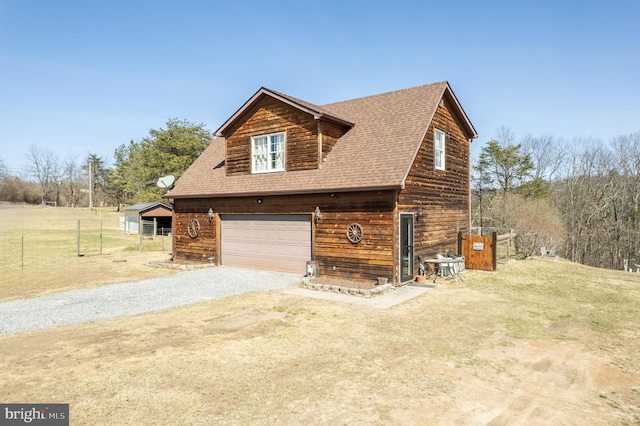 view of side of home with a garage, a lawn, gravel driveway, and roof with shingles