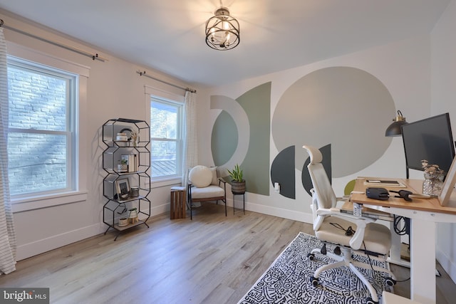 office with light wood-style floors and baseboards