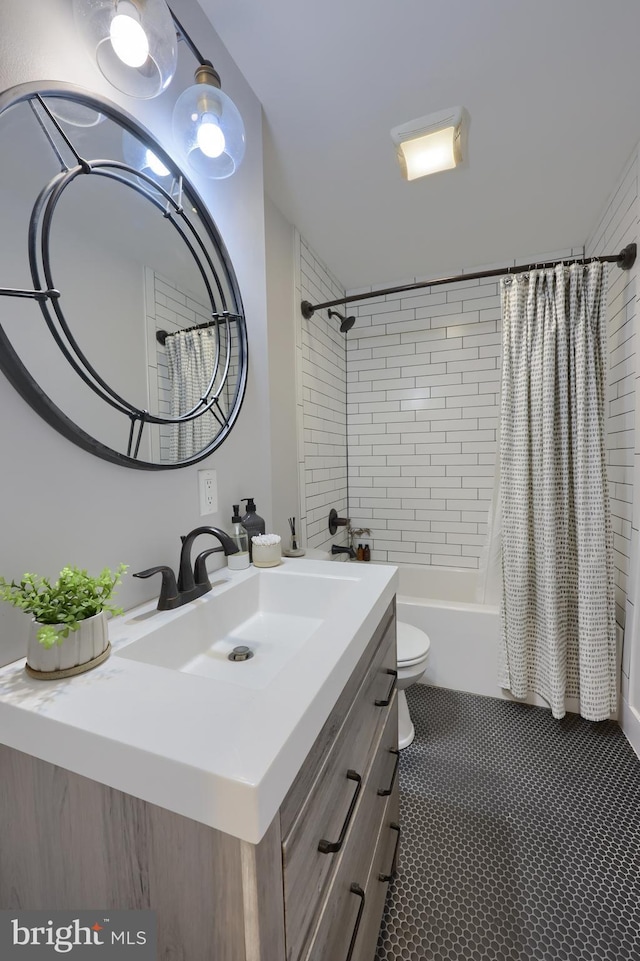 full bath featuring shower / tub combo, vanity, and toilet