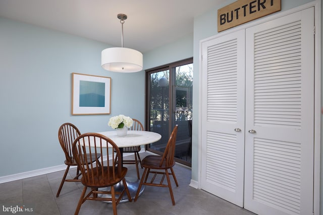 tiled dining area with baseboards