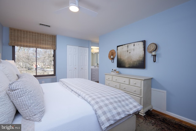 bedroom with a closet, visible vents, a ceiling fan, and baseboards