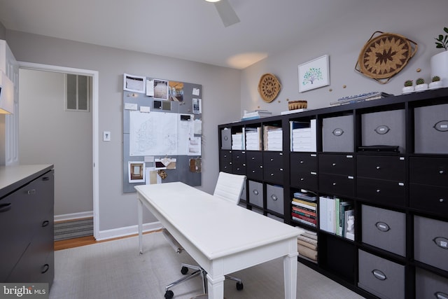 office area featuring visible vents, baseboards, and light wood-style flooring