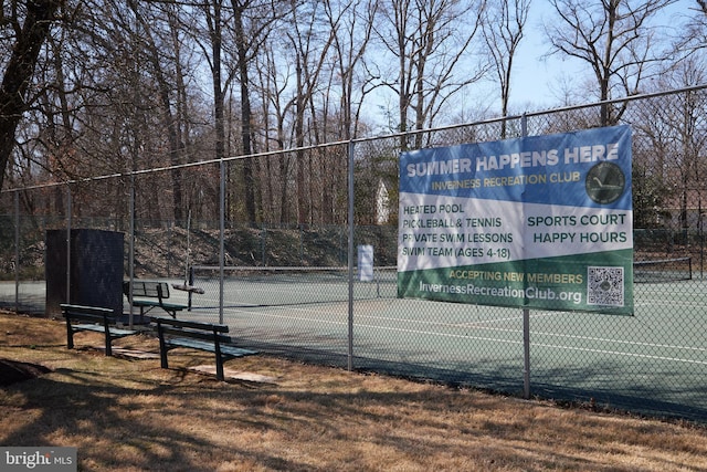 view of tennis court with fence