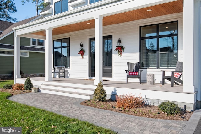 doorway to property with a porch