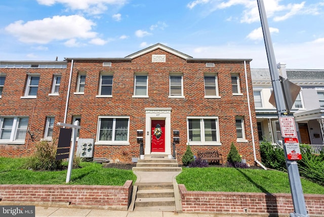 view of property with brick siding