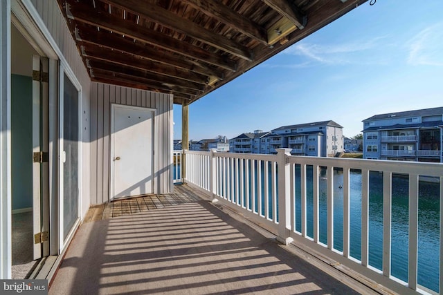 balcony with a water view and a residential view