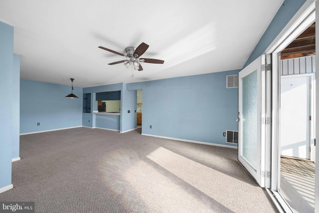 unfurnished living room featuring ceiling fan, carpet, visible vents, and baseboards