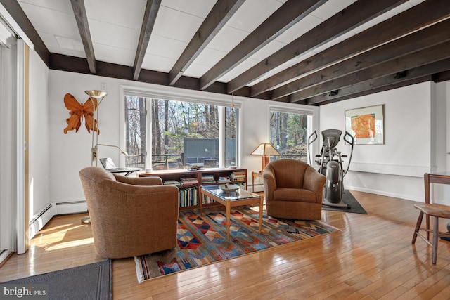 living area with beam ceiling, baseboard heating, and wood-type flooring