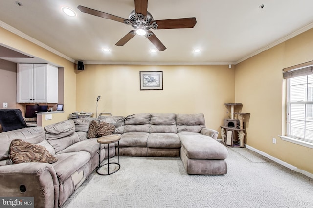 living area with baseboards, light colored carpet, ornamental molding, recessed lighting, and a ceiling fan