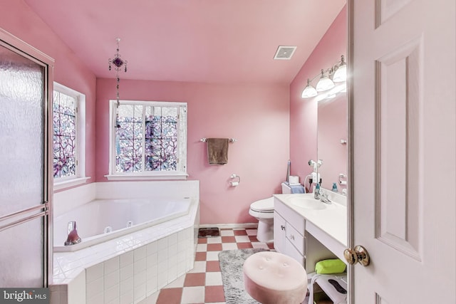 full bath featuring visible vents, toilet, tile patterned floors, a tub with jets, and vanity
