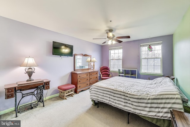 bedroom with baseboards, carpet, and a ceiling fan