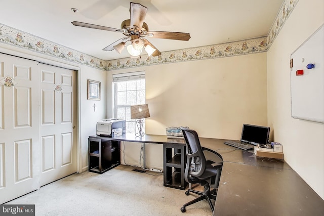 home office with carpet floors and ceiling fan