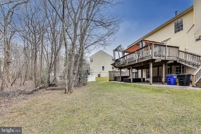 view of yard with a wooden deck and stairs