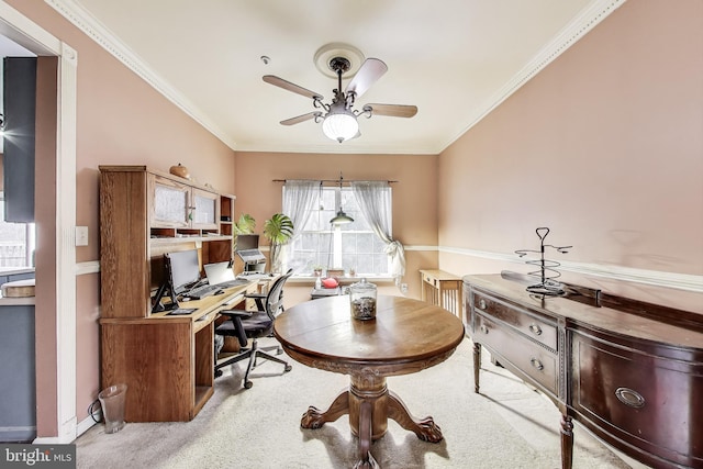 office space featuring baseboards, carpet floors, ceiling fan, and crown molding