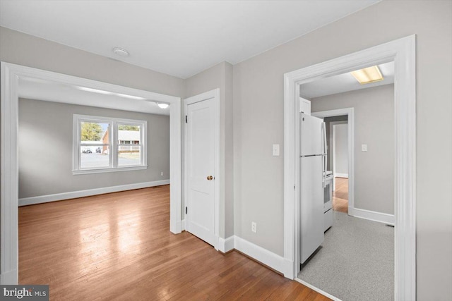 interior space featuring wood finished floors and baseboards